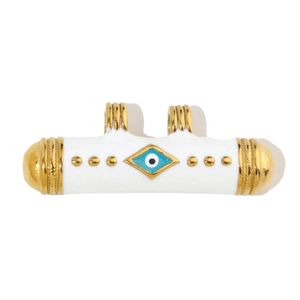 Detail view of gold-plated cylinder evil eye charm with white enamel and dual rings