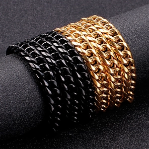 Polished gold and black Cuban link chains wrapped on a cylinder for men jewelry