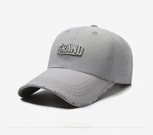 Detail of gray quick-dry sport cap featuring 3D GRAND embroidery and laser-cut side vents