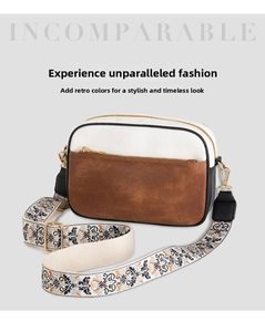 Detail of vintage patchwork camera bag with colorful ethnic embroidered shoulder strap