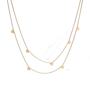 Macro shot of 18K gold plated double layered necklace with small heart pendants detail