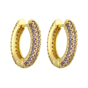 Detail of luxury gold hoop earrings with pavé-set purple round cut cubic zirconia stones