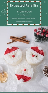 Three Santa Claus scented candles with white lace, cinnamon sticks and pine cones detail