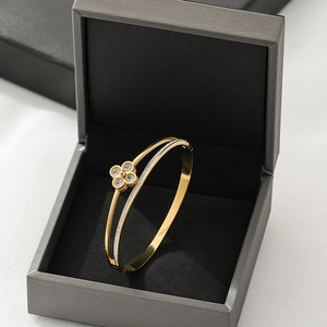 Rose gold clover open bangle for women with white zircon stones in a premium jewelry box
