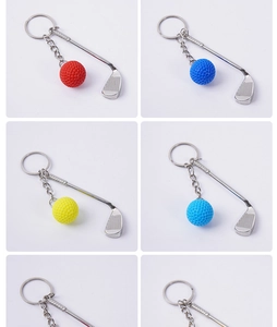 Close-up of mini golf club keychain with colorful ball and polished zinc alloy head