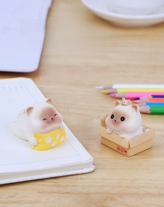 Creative resin cat figurines on desk featuring cat with pillow and cat in a box