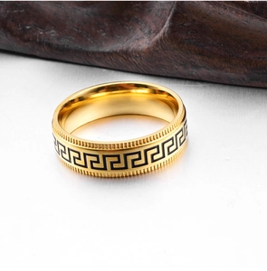 Macro view of 8mm gold stainless steel ring featuring black Greek key pattern texture