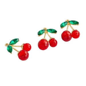 Three fresh cherry pendants with red resin fruit and golden metal stems on white base