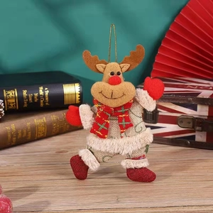 Detailed view of burlap Christmas reindeer ornament with a red and green plaid scarf