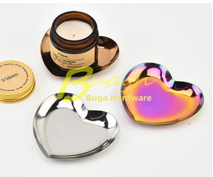 Macro view of heart shaped stainless steel trays in gold, silver and iridescent finishes