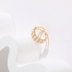 Detail of 14K gold plated ring with triple rows of pearls and sparkling zircon stones