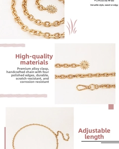 Detail of matte gold alloy punk chain belt featuring a sun pendant and lobster clasp