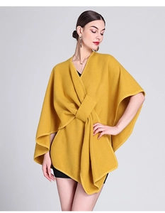 Detailed view of a yellow knit poncho cape with a stylish front tie design for women