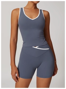 Detail view of the gray-blue sports set with contrast white trim and high-waist shorts