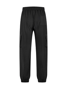 Rear view of black waffle texture cargo pants featuring elastic waist and tapered cuffs