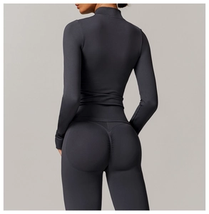 Detail view of high-waist yoga leggings with V-shaped back seam and push-up effect