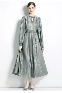 Close-up of beaded hollow collar and pleated metallic texture on silver evening dress
