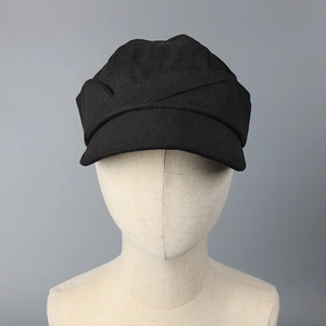 Classic black linen newsboy cap with stylish pleats shown on a professional mannequin head