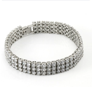 Close-up of triple-row silver tennis bracelet with sparkling cubic zirconia inlays