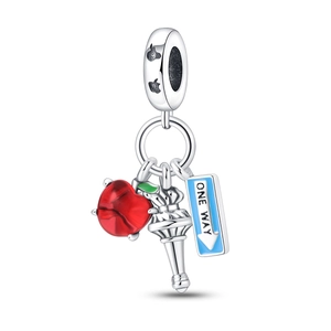 Detail view of silver charm with colorful enamel apple, torch, and One Way sign