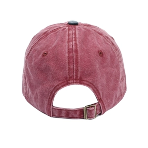 Vintage washed red baseball cap from rear view showing adjustable metal buckle strap