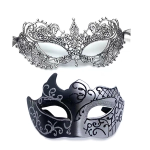 Detail of silver lace tiara mask and black glitter masquerade mask for festive party costumes