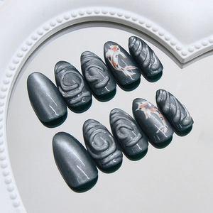 Cat-eye press-on nails with 3D spiral texture and koi fish design on heart mirror