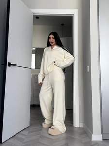Women's cream white knit lounge set featuring a polo sweater and wide-leg drawstring pants