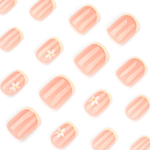 French tip press-on nails with yellow floral daisy designs and nude base