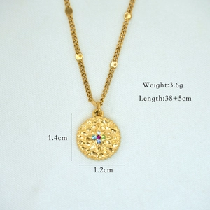 Detailed macro view of 14k gold necklace with colorful zircon stones and size specs
