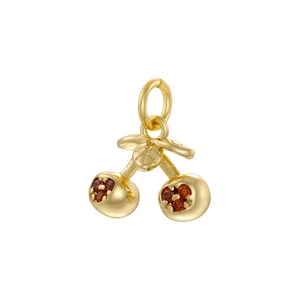 Detailed view of a gold cherry pendant featuring sparkling red inset gemstones