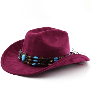 Detail of dark purple suede cowboy hat featuring bohemian beaded band with turquoise stone