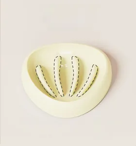 Close-up of beige slow feeder pet bowl with four curved pillars to prevent choking