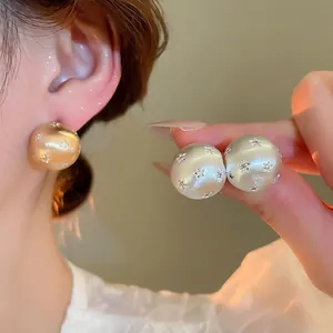 18k gold plated brushed sphere stud earrings with star-set cubic zirconia stones