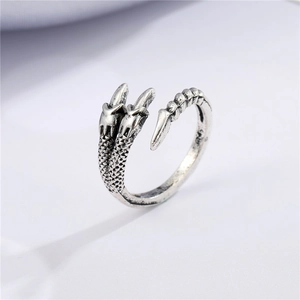 Detailed view of retro silver dragon claw open ring with intricate punk scale texture