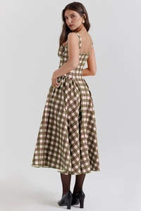 Side view of elegant plaid maxi dress with green and beige grid pattern and thin straps