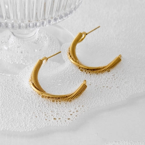 Chic gold-plated C-shaped hoop earrings with intricate spiral texture and wire wrapping