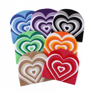 Knitted beanie hats with heart pattern in seven vibrant colors for winter warmth