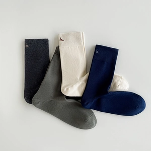 Business crew cotton socks for men in assorted colors featuring embroidered details