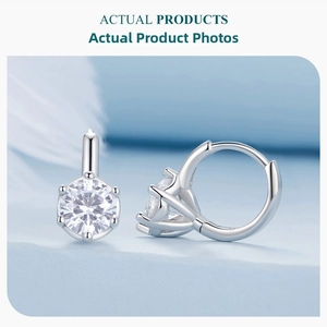 Macro detail of S925 silver hoop earrings with brilliant six-prong set cubic zirconia