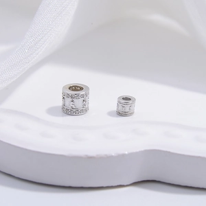 Macro view of S925 sterling silver beads with zircon micro-pave and vintage relief details