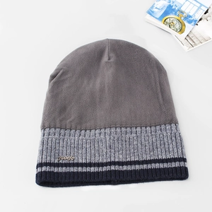 Winter men's ribbed knit beanie in grey and navy with fleece lining and metal sport logo