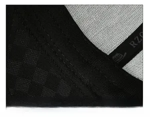 Detail of reinforced sweatband and fine double stitching on black baseball cap