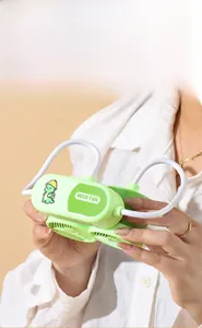 Close-up of green cartoon dinosaur neck fan with adjustable white lanyard held by hand