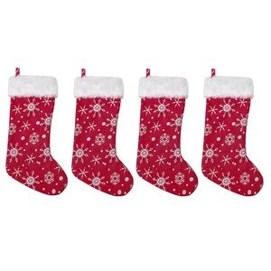 Set of four red Christmas stockings with white snowflake embroidery and plush faux fur trim