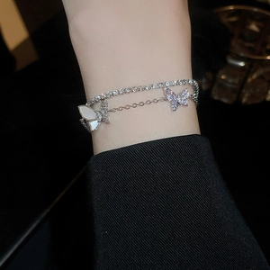 Double-layer silver butterfly bracelet with zircon and white shell on female wrist