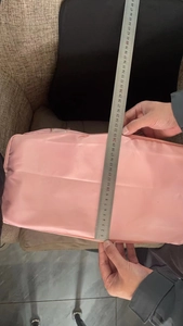 Pink waterproof nylon travel storage bag showing a flat length measurement of 45cm