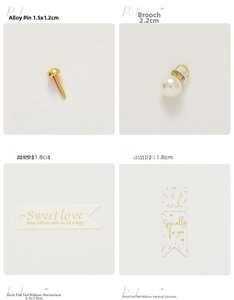 Detail of metal alloy fasteners, pearl pendants, and gold-stamped wedding gift tags