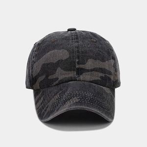 Detail of dark grey camouflage baseball cap showing washed denim texture and stitching