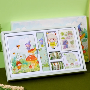 Detail view of the forest green stationery set with a notebook, ruler, and stickers